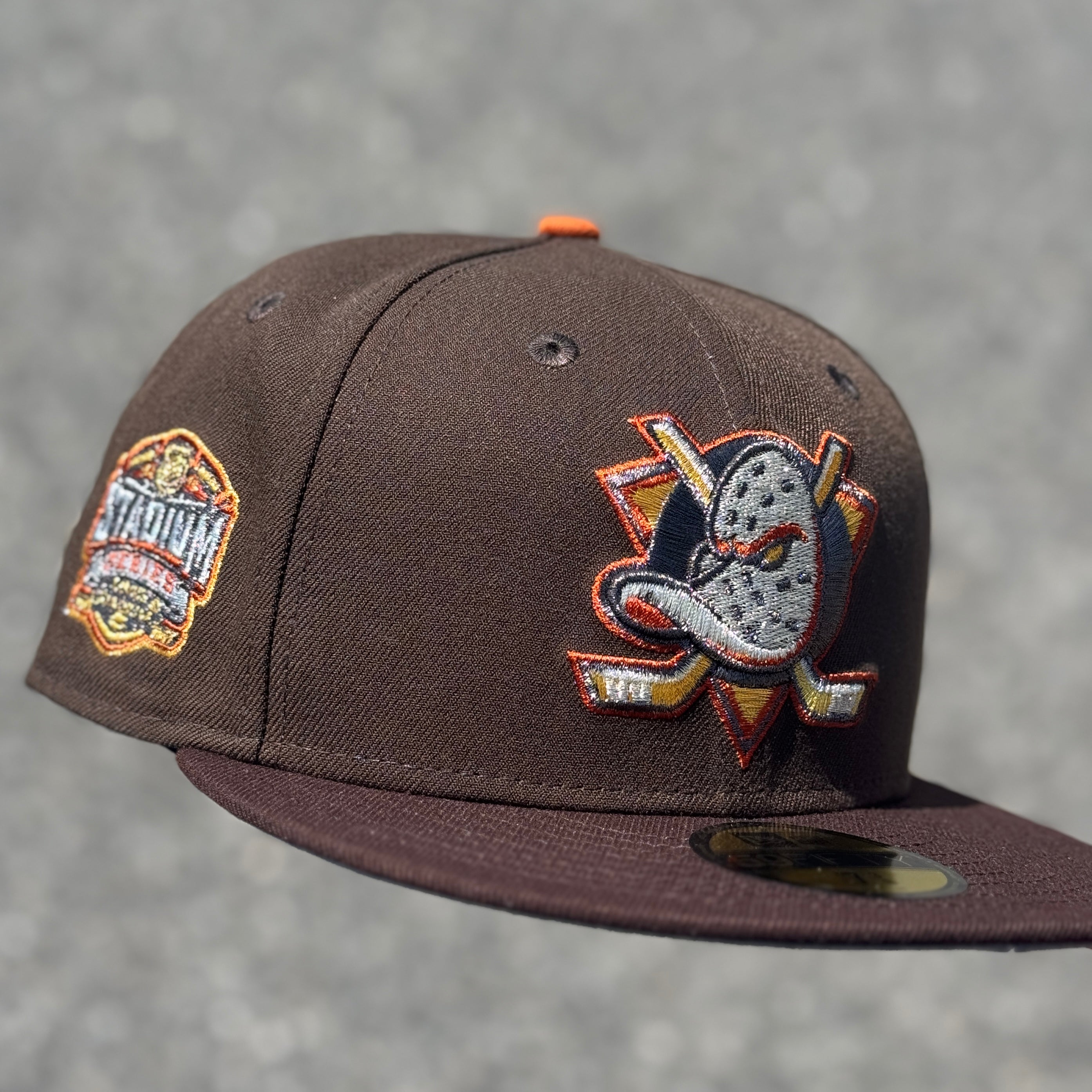 Anaheim Ducks Stadium Series Side Patch Fitted Hat New Era 5950 NHL (Walnut Brown / Burntwood Brown / Gold / Copper / Silver / Orange / Gray)