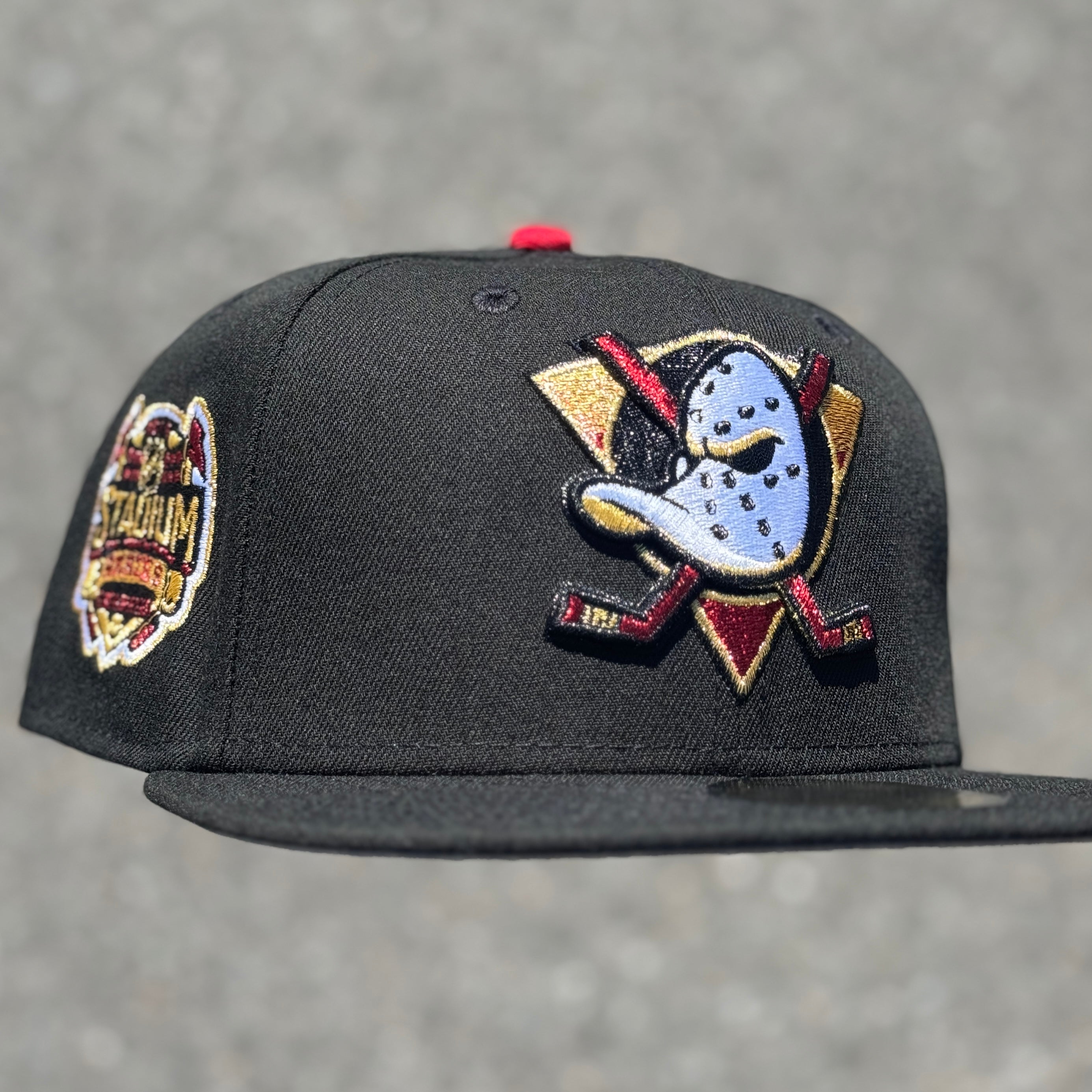 Anaheim Ducks Stadium Series Side Patch Fitted Hat New Era 5950 NHL (Black / Metallic Red / Metallic Gold / White / Gray)